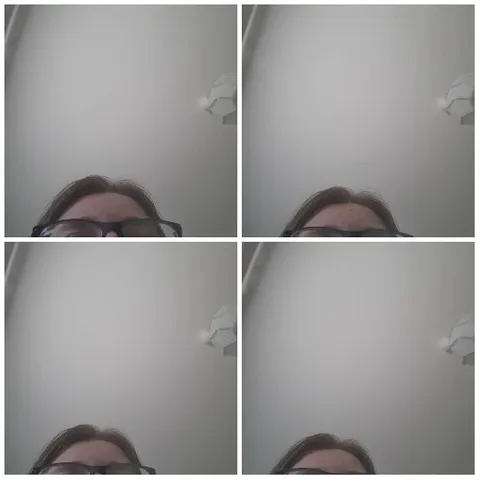 Person Wearing Glasses and Light Fixture