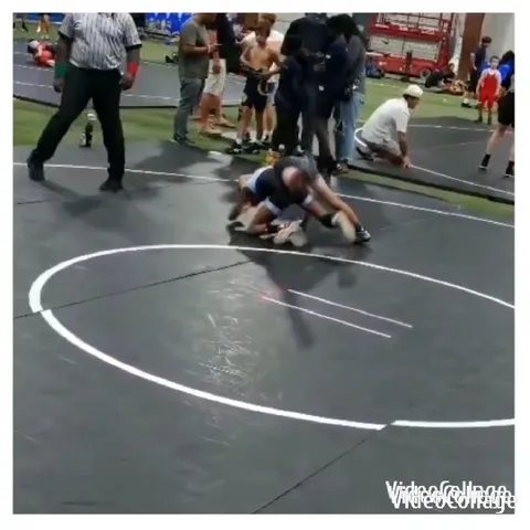 Wrestlers Compete in Sports Arena