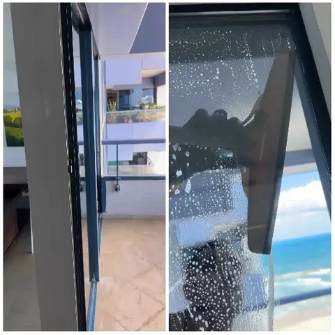 Cleaning Glass Door By The Beach