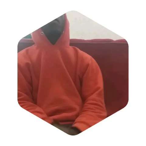 Person in Red Hoodie on Couch