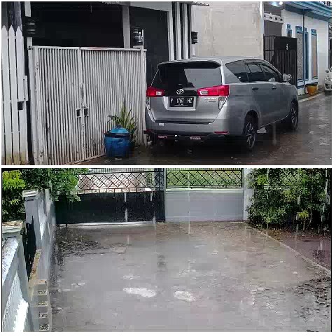 Car in Rain with Blue Container