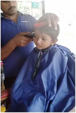 Child Getting Haircut at Barbershop