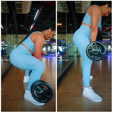 Woman Deadlifting in Gym Setting
