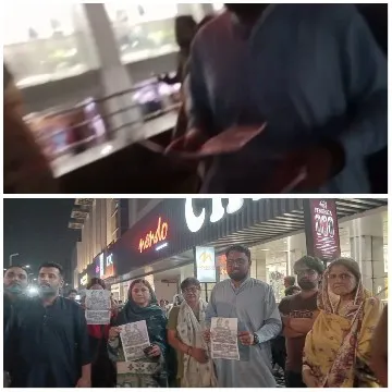 People Distributing Flyers Outside Mall