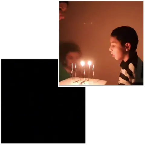 Boy Blowing Out Birthday Candles