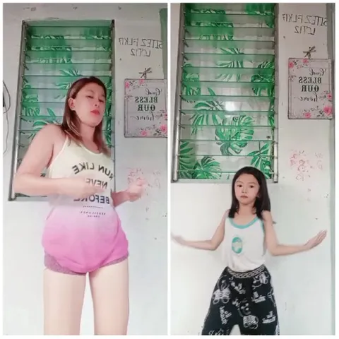 Woman and Girl Dancing Together
