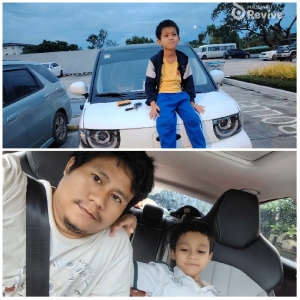 Child on Car Hood and Inside Vehicle