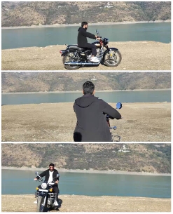 Motorcyclist by Water and Mountains