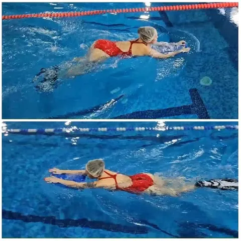 Swimmer Practicing with Kickboard