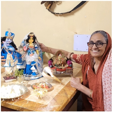 Elderly Woman with Religious Statues