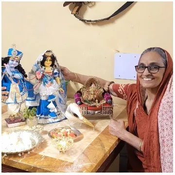 Elderly Woman with Religious Statues