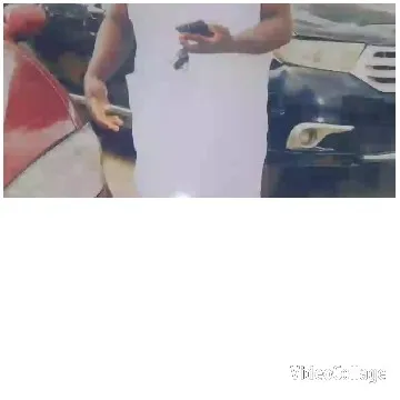 Person Holding Phone with Cars Behind