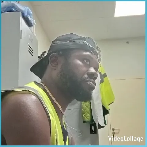 Man in High-Visibility Vest Indoors