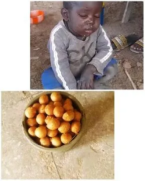 Child with Dirty Face and Snacks