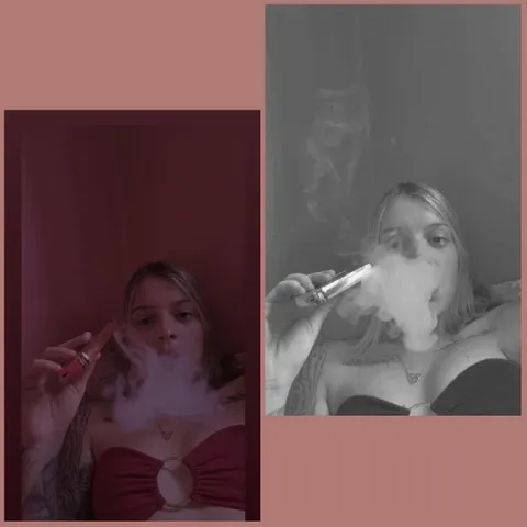 Person Exhaling Smoke with E-Cigarette