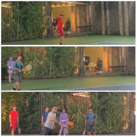 People on Tennis Court in Action