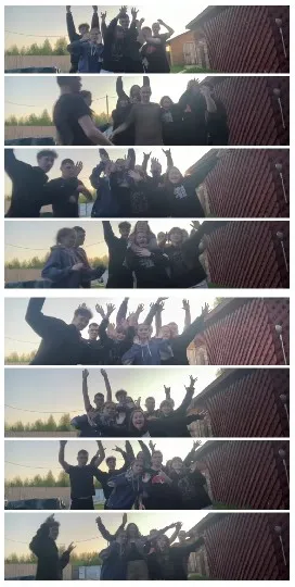 Joyful Group Near Red Building