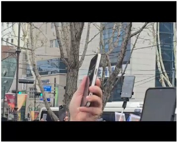 People Recording in Urban Setting