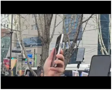 People Recording in Urban Setting