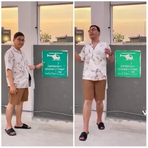 Person Pointing at Emergency Sign