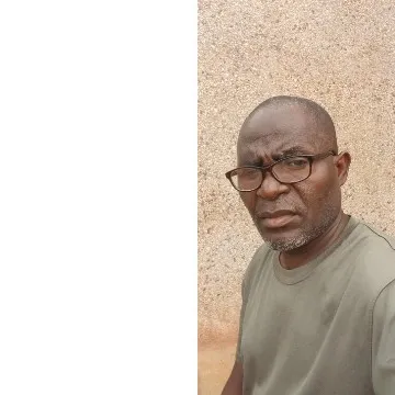 Man Posing Against Textured Wall