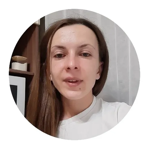 Person Speaking Against a Shelf