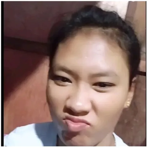 Funny Expression Against Brown Wall