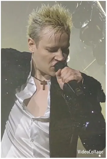 Singer with Spiky Hair on Stage