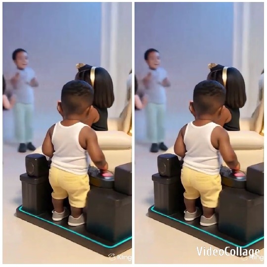 Child Pressing Button and Cheer