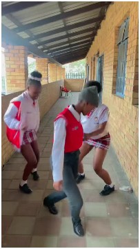 Students Dancing in School Corridor