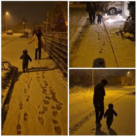 Family Walking in Snowy Night