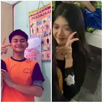 Young Person Making Peace Sign Indoors