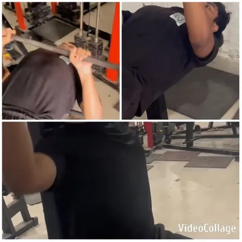 Man Performing Bench Press at Gym