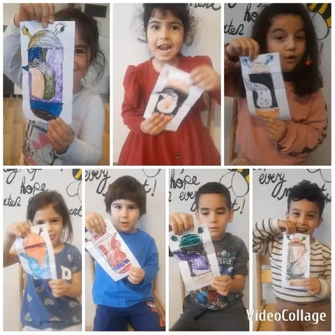 Children Holding Penguin Drawings