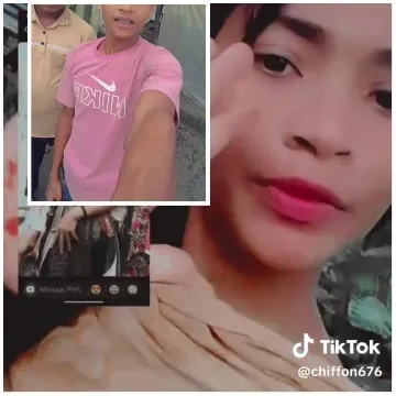 Person Gesturing in Pink Shirt