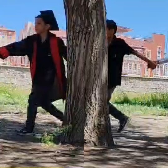 Playful Young Men Around Tree