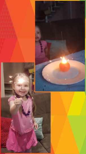 Child Smiling with Sparkler