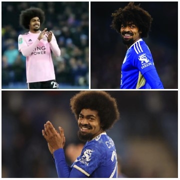 Football Player Smiling in Stadium