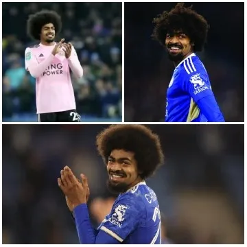 Football Player Smiling in Stadium