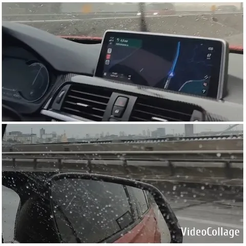 Car Dashboard and Rainy City View