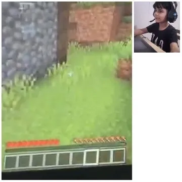 Gamer Using Computer and Headphones
