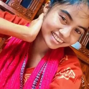 Person Smiling in Warm Room