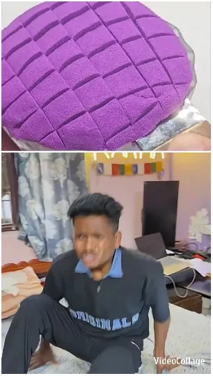 Hand Holding Purple Object