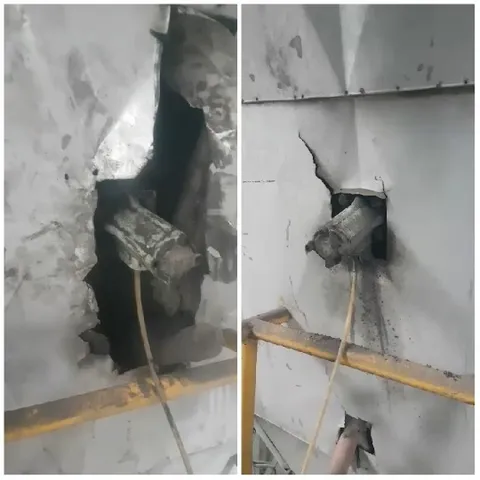 Damaged Metal Wall with Pipes