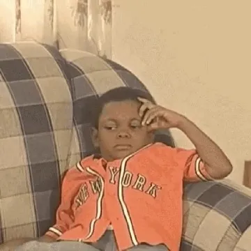 Boy Reflecting on Plaid Chair
