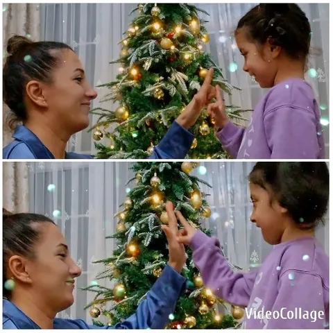 Women Smiling by Christmas Tree