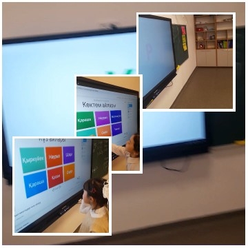 Child Pointing at Digital Screen