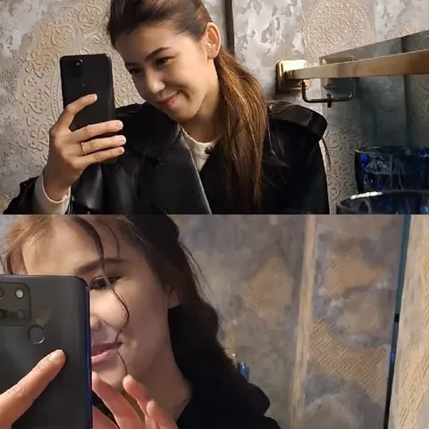 Selfies in a Decorative Bathroom