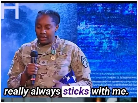 Military Person Holding American Flag