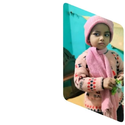 Child in Pink Hat Indoors